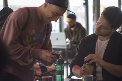 Two attendees chatting during a break