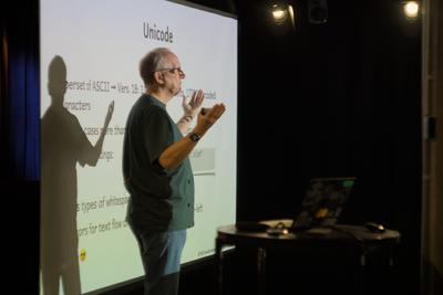 Stephan in front of a slide about Unicode