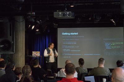 Augustin on stage showing a getting started slide