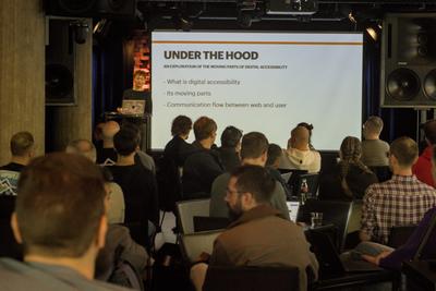 The audience watching Carme Mias's talk 'Under the hood'