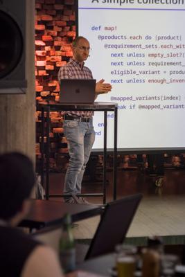 Nicolò presenting a slide of Ruby code